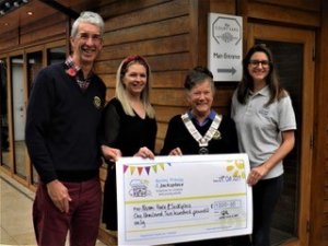 Hartley Wintney Pram Race l-r Steve Watling, Laura Roberts and Betty Key present cheque to Lucy Gray